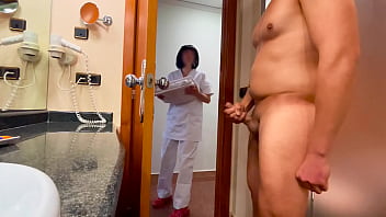 I surprise the hotel cleaning lady who comes to clean the rest room and helps me conclude cumming
